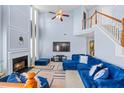 Inviting living room with soaring ceilings, fireplace, plush seating, and bright, neutral paint at 4381 Prather Son Dr, Loganville, GA 30052