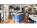 Open-concept kitchen featuring a large island, granite countertops, stainless steel appliances at 1207 Thornwell Ne Dr, Brookhaven, GA 30319