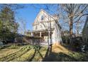 Traditional home with a covered front porch, showcasing its well-kept lawn and curb appeal at 436 Avery St, Decatur, GA 30030