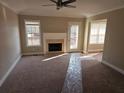 A cozy living room with a fireplace and access to the deck at 1012 Riverclift Dr, Covington, GA 30016