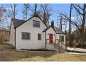 Angle view of the beautiful house with a manicured lawn and welcoming entrance at 1870 Avon Sw Ave, Atlanta, GA 30311
