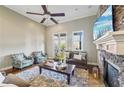 Inviting living room with stone fireplace, ceiling fan, and french doors to outdoor space at 255 Southerland Ne Ter # 207, Atlanta, GA 30307