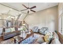 Cozy living room with a ceiling fan, access to the upper level, and comfortable seating at 255 Southerland Ne Ter # 207, Atlanta, GA 30307
