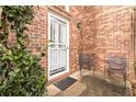 Charming front porch featuring a brick wall, secure door, and outdoor seating at 1647 Club Vista Trce, Stone Mountain, GA 30088
