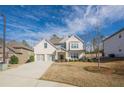 Beautiful two-story home with a two-car garage, showcasing its well-maintained lawn at 614 Denali Dr, Mableton, GA 30126