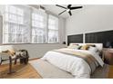 Bright bedroom featuring large windows, hardwood floors, and minimalist decor at 978 North Ne Ave # 307, Atlanta, GA 30306