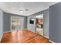 Bright dining room with hardwood floors and sliding glass doors to the backyard at 2340 Beaver Ruin Rd # 68, Norcross, GA 30071