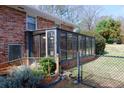 The sunroom addition is surrounded by an iron fence at 636 Counsel Ne Dr, Marietta, GA 30068