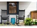 Inviting porch with rocking chairs and a colorful side table, perfect for relaxing at 1171 Eggleston Sw St, Atlanta, GA 30310