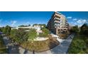 Beautiful exterior view of a multi-story apartment building with walkways and lush greenery at 675 Drewry Ne St # 201, Atlanta, GA 30306