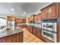 Spacious kitchen features stainless appliances, granite counters and wood cabinets at 2953 Kings Walk Ave, Marietta, GA 30062