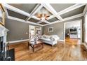 Formal living room features coffered ceiling, hardwood floors, and lots of natural light at 2953 Kings Walk Ave, Marietta, GA 30062