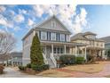 Inviting two-story home with blue shutters and a covered front porch at 3673 Howard Dr, College Park, GA 30337