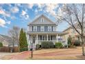 Attractive two-story home with a classic covered front porch and tidy lawn at 3673 Howard Dr, College Park, GA 30337