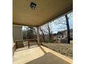 View of the backyard with railing from under the covered back porch at 4373 Trake Way, Ellenwood, GA 30294