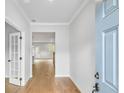 Inviting foyer with hardwood floors, light grey walls, and views to other rooms at 6074 Marigold Way, Atlanta, GA 30349