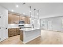 Beautiful kitchen with a center island, modern appliances, and ample cabinet space at 6074 Marigold Way, Atlanta, GA 30349