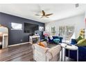 Bright living room showcasing a large TV, cozy furniture and sliding door at 1405 Lyon Way Dr, Lawrenceville, GA 30044