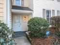 Inviting front door and landscaped entrance with a security system sign at 4126 N Gloucester Pl, Atlanta, GA 30341