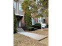 Inviting townhome featuring a well-manicured front yard and convenient walkway at 5027 Bayrose Cir # 27A, Atlanta, GA 30344