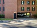 Brick building with covered parking, offering convenient and protected vehicle storage at 23210 Plantation Ne Dr, Atlanta, GA 30324