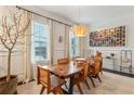 Bright dining room with a unique wooden table, modern lighting, and stylish decor at 2111 Lilly Nw Way, Atlanta, GA 30318