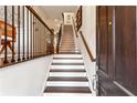 Inviting entryway features hardwood floors and a staircase leading to the upper level at 2111 Lilly Nw Way, Atlanta, GA 30318