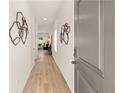 Inviting hallway features hardwood floors, recessed lighting and modern wall decorations at 225 Epping St # 92, Stockbridge, GA 30281