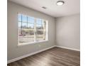 Bright room with lots of light provided by the large window and contemporary flooring at 325 Nutwood Trce, Locust Grove, GA 30248