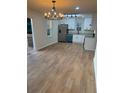 Open concept kitchen with stainless appliances, granite counters, and bright lighting at 1753 Lee St, Decatur, GA 30035