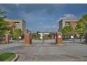 Gated community entrance with brick pillars and manicured landscaping at 898 Oak # 3421, Atlanta, GA 30310