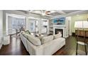 Open concept living area with fireplace, coffered ceilings and view of dining area at 1989 Brightleaf Way # 143, Marietta, GA 30060