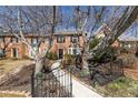 Brick townhome featuring meticulous front landscaping, complemented by mature trees at 1281 Whitlock Ridge Sw Dr, Marietta, GA 30064