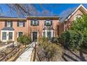 A well-maintained brick townhome with a welcoming walkway and lush greenery at 1281 Whitlock Ridge Sw Dr, Marietta, GA 30064