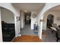 Inviting entryway with hardwood floors and decorative archways into adjacent rooms at 6497 Snowden Dr, South Fulton, GA 30349