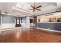 Open-concept living area featuring hardwood floors, decorative molding, and abundant natural light at 1675 Dodson Sw Dr, Atlanta, GA 30311