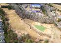 Picturesque aerial view of the home overlooking a lush green golf course in a vibrant residential neighborhood at 250 High Court Way, Locust Grove, GA 30248