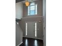 Bright foyer features a high ceiling, pendant lighting, and an arched window above the front door at 215 Bradley St, Covington, GA 30016