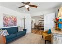 Comfortable living room with plush seating, decorative art, and a doorway leading to the dining area at 236 Augusta Walk, Canton, GA 30114