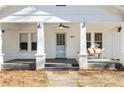 Welcoming front porch with bench seating and view of the house number at 915 Homer Rd, Woodstock, GA 30188