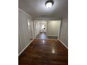 View of the dining room leading into the kitchen, featuring wood floors at 1686 Valencia Rd, Decatur, GA 30032