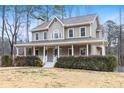 Inviting two-story home featuring a covered front porch and well-maintained landscaping at 194 Preston Nw Pl, Dallas, GA 30157