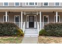 A spacious front porch with white railings and a view of the front door at 194 Preston Nw Pl, Dallas, GA 30157