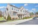 Charming multi-story townhome with well-maintained landscaping and a welcoming entrance at 2000 Cortland Rd, Milton, GA 30009