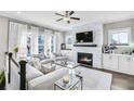 Bright living room with fireplace, large windows, comfortable seating, and elegant decor at 2000 Cortland Rd, Milton, GA 30009