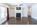 Inviting living room featuring hardwood floors, fireplace, and large windows for natural light at 464 Eager Ct, Marietta, GA 30064