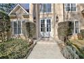 Close-up of the front entrance, highlighting the double doors and sconce lighting at 551 Lees Mill Rd, Fayetteville, GA 30214