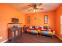 Cozy living room featuring hardwood floors, colorful sofas, and a ceiling fan at 5809 Savannah River, Atlanta, GA 30349