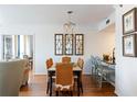 Well lit dining room featuring a modern chandelier and unique mirrors on the wall at 3481 Lakeside Ne Dr # 2207, Atlanta, GA 30326