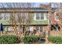 Inviting townhouse with well-maintained landscaping, a brick facade, and a welcoming entrance at 307 Adair St # 7-E, Decatur, GA 30030